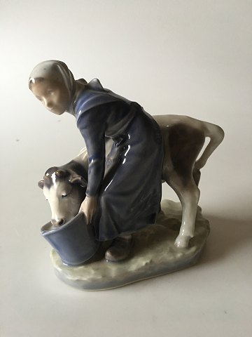 Royal Copenhagen Figurine Girl with Calf No. 779