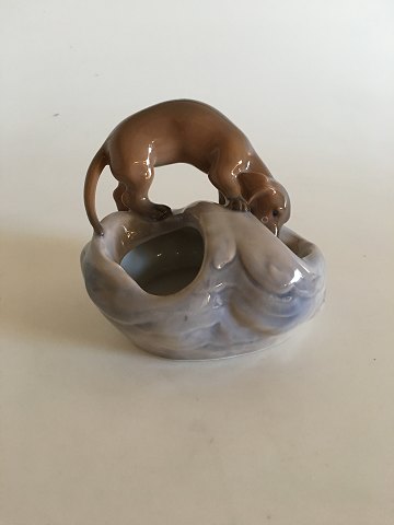 Royal Copenhagen Art Nouveau Dog on Mound No 693. Measures 11cm high and in perfect condition and 1st quality.