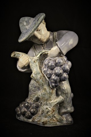 Glazed ceramic figure from L.Hjorth - Denmark. of grape picker.H: 25cm.