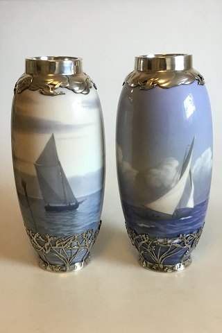 Royal Copenhagen Art Nouveau A pair of vases decorated with ship motifs and Sterling Silver Ornaments Stamped Michelsen ER 1916 No 1438/763 and 1462/763