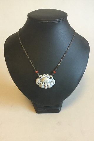 Royal Copenhagen Pendant of porcelain designed by Arje Griegst. Sterling Silver by Anton Michelsen