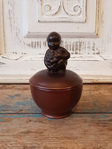 Aluminum small lid bowl with boy with grape bunch on the lid