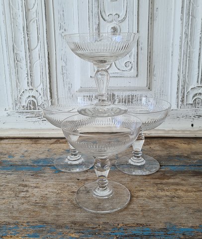 Set of four beautiful French champagne bowls decorated with olive grinds.
