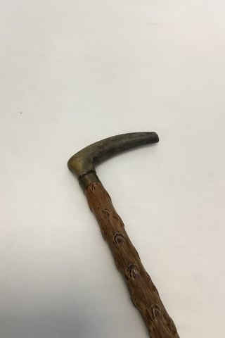 Antique Irish walking stick w.  head of carved antlers horn and shaft of black thorn. Collar of white metal, No ferule.