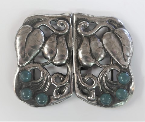 Jugend Silver belt buckle (830) with 6 green stones. Length 7 cm. Width 6 cm. Stamped 830S and IH.