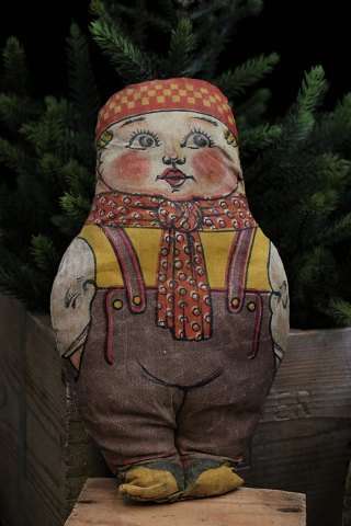 Old fabric doll of a little boy with straw filling.Height: 22cm.