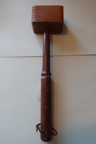 An old meat tenderiserWith a good patinaMade of wood