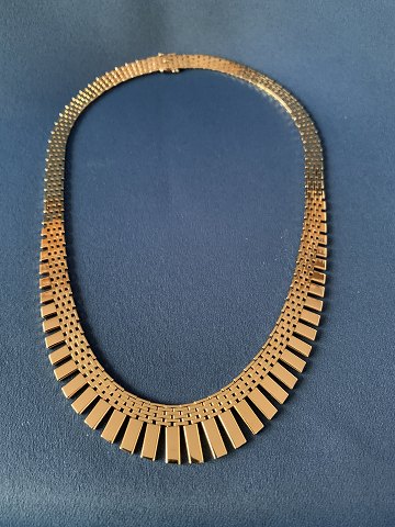 Necklace in 14 carat gold, bricks in 7 rows, with process, stamped 585 JTH. Length 41 cm.