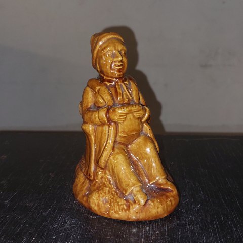 Piggy money  bank: Old man sitting with his wallet