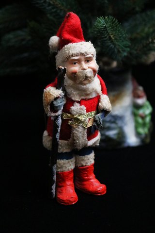Nice, old Santa Claus from the 40s / 50s in felt clothes with small red boots and a stick...
