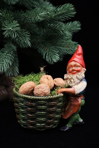 Old painted terracotta elf with a wicker basket for nuts, Christmas sweets or for a block candle...