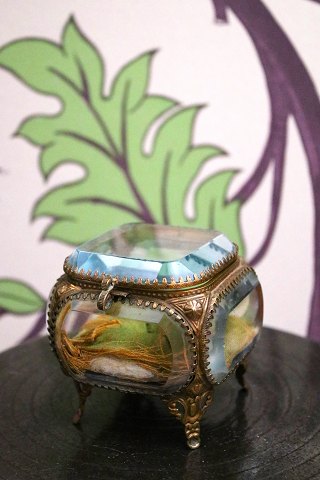 Antique French jewelry box in bronze with faceted glass and silk cushion at the bottom...