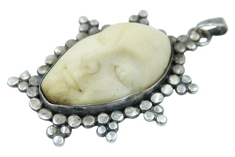 Large sterling silver pendant with face in bone