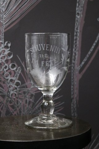 Old French souvenir wine glass with engraved writing and decorations. "Souvenir de la feté"