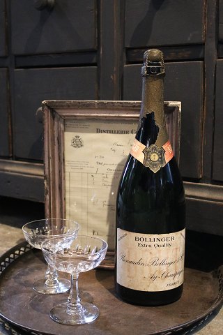 Decorative, old French advertising Bollinger champagne bottle with a really nice patina...