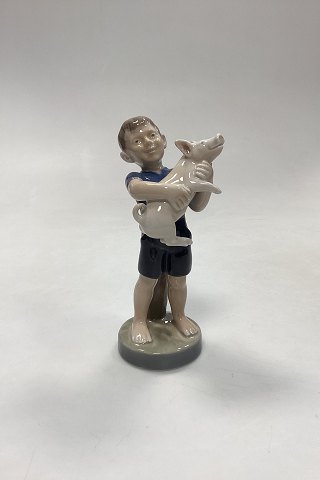 Royal Copenhagen Monthly Figurine August - Boy with Piglet No. 4530