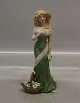 Royal Copenhagen figurine 0551 RC "Spring Time" Girl in green with flower basket ca 21 cm