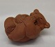 Royal Copenhagen Art Pottery Un glazed red clay21434 RC Brown bear cub - sucking paw on back 5 x 8 cm (1 49 234) Knud Kyhn, 1957