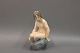 Kgl. figur nr. 4027, Nøgen dame på sten.  Højde 15 cm. 5000 m2 udstilling.  