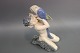 Kongelig porcelænsfigur,Faun siddende med en papegøje, nr. 752. Figuren fra 1964.5000m2 udstilling.