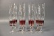 Otte champagneglas med rødt mønster.5000m2 udstilling.