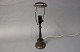Bordlampe i patineret diskometal af Just Andersen, model 02.5000m2 udstilling.