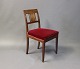 Antique chair in mahogany with red upholstered seat from 1910 in the style late Empire.5000m2 showroom.