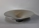 Skål i børstet stål med plastik fod af Georg Jensen Denmark.