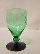Hvidvinsglas, "Ranke" fra HolmegaardGrøn kumme og sort fodH: 10,5cmHaves: 24 stk. Dkr.590,- pr. stk, særpris vedsamlet  køb af alle 24 glasVi har et stort udvalg af antikke glasKontakt os for yderligere information