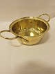 Colander made of brassAntique Colander with 2 beautiful earsAbout 1840Diam. inkl. ears: 35cm, excl. ears 23,5cmH: inkl. ears: 13cm, excl. ears 10cmNo stampPlease note: Small dent