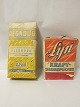 Blegsoda/Regndug til iblødsætning og "Lyn" kraftskurepulverI originale pakninger og med originalt indholdRegndug: Dkr. 100,-Lyn: Dkr. 65,-Vi har et stort udvalg af gamle købmandsvarer med originalt indholdKontakt os for yderligere information