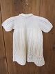 Sweaterdress for the childAn old sweaterdress for the child. The sweaterdress has hand-knitted buttonsWe have a large choice of old/antique cloth for children/baby, bed clothes etc.