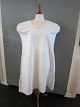 Shift / dressAn old shift made of flax with the old buttons embroidery, gusset in the seam in the side etc.The antique, Danish linen and fustian is our speciality and we always have a large choice of shifts, babydress, tea towels, table clothes etc.