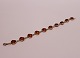 Bracelet with heart shaped pieces of amber and og silver.