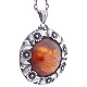 N. E. From; A silver pendant with amber and flowers