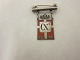 Royal batch made of Sterling silver 925S with red enamel motif of the DannebrogThis batch is made as a brooch with a beamYear 1870-1945 is on as well as Christian XThe Silver smithy of Georg Jensen produced it in 1940-47