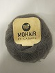 Brushed Lace er et naturprodukt af højeste kvalitet fra  sydafrikanske angorageder blandet med den fineste Mulberry Silke.Den viste farve er: Taupe, Farvenr. 3007Prisen er pr. nøgle med 25 gram Brushed Lace