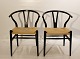 Et sæt Y-stole, model CH24, designet af Hans J. Wegner i 1950 og fremstillet hos Carl Hansen & Søn i 2008.5000m2 udstilling.