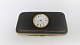 Velholdt brilleetui med ur. Længde 14 cm. Urværk fungerer. Optræksnøgle medfølger. Produceret før år 1900.