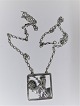 Georg Jensen. Sølv vedhæng med kæde. Sterling (925). Design 96. Bredde 4 cm. Produceret 1933 - 1945.