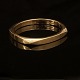John Sørensen: Oval armbøjle i 14kt guld guld med skjult lås. Indv. mål: 5,3x5,8cm