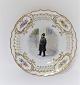 Royal Copenhagen. Tallerken med gennemskåret roset. Diameter 19 cm. Motiv ; politibetjent. Produceret før 1923.