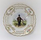 Royal Copenhagen. Tallerken med gennemskåret roset. Diameter 19 cm. Motiv ;  Mand fra Amager. Produceret før 1923.