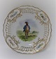 Royal Copenhagen. Tallerken med gennemskåret roset. Diameter 19 cm. Motiv ;  Mand fra Mariager-egnen. Produceret før 1923.