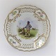 Royal Copenhagen. Tallerken med gennemskåret roset. Diameter 19 cm. Motiv ; Mand fra Fyn. Produceret før 1923.
