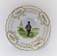 Royal Copenhagen. Tallerken med gennemskåret roset. Diameter 19 cm. Motiv ; Bonde fra Amager. Produceret før 1923.