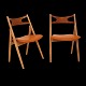 Hans J. Wegner, Denmark: Set of four "Sawhorse Chairs", CH29, by Carl Hansen & Søn, Denmark, with new upholstery