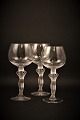 Decorative old wine glass from the 70s / 80s in crystal glass with foot of woman carrying the glass.