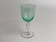 Green Holmegaard Pfeiffer glass for white wine. Smooth, green bowl and faceted stem