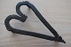 Antique foot for the iron, hand made smith's workThis beautiful piece of hand forged iron is in a form of a heart, and it is presumably made as a gift for his fiancéL: 15cmW: 8,5cmH: ca. 3cm1800-YearsIn a good condition